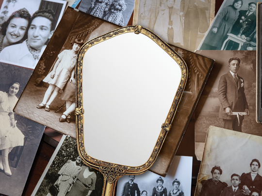A mirror on vintage family photos