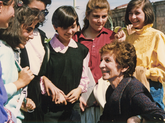 Simone sharing a moment with young students in Armenia.