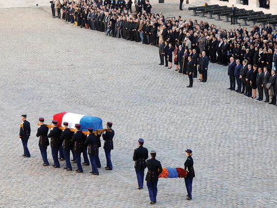 Republican Guards carry the flag-draped casket of late singer Charles Aznavour during a national tribute at the Hôtel des Invalides in Paris, France.