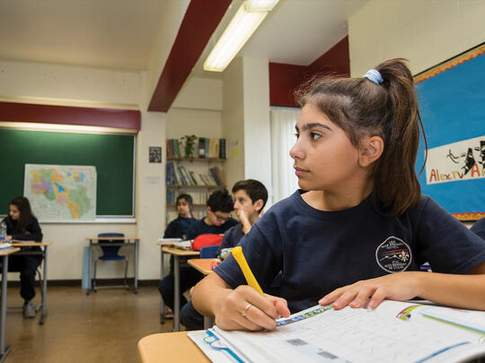A student at the AGBU Alex Manoogian School in Montreal takes notes during class.