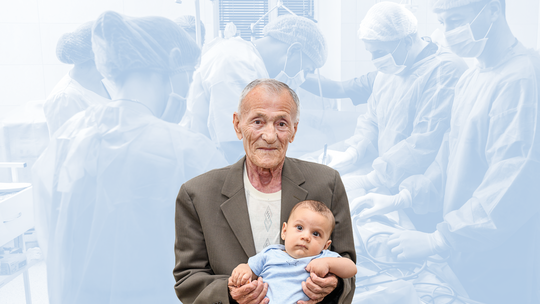 National Wellness, a man holding a child in front of a faded background of doctors operating on a patient.